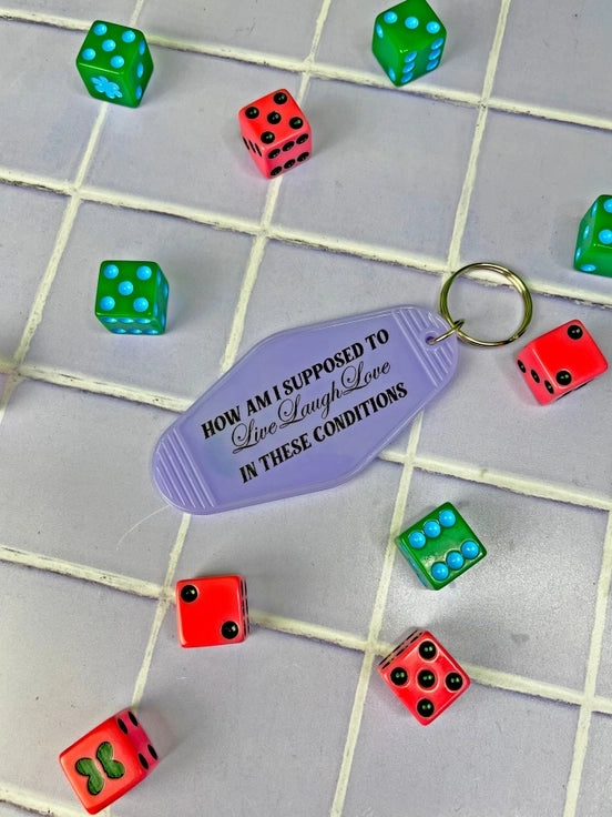 These Conditions Keychain by A Shop of Things