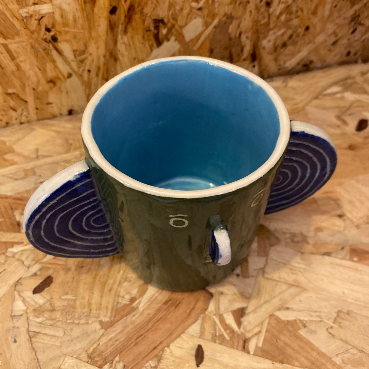 Green & light blue Head Mug by John Molesworth