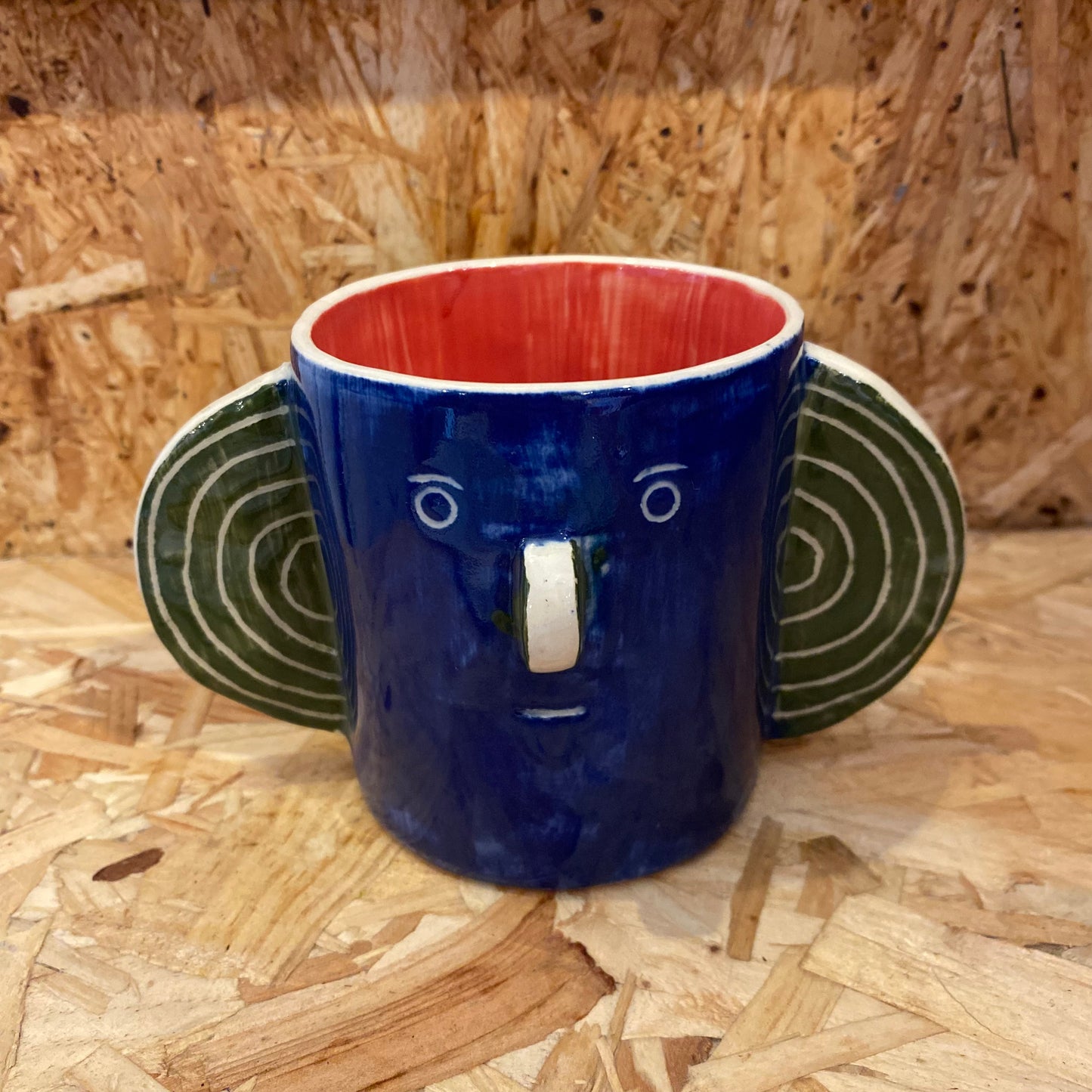 Blue & Red Head Mug by John Molesworth