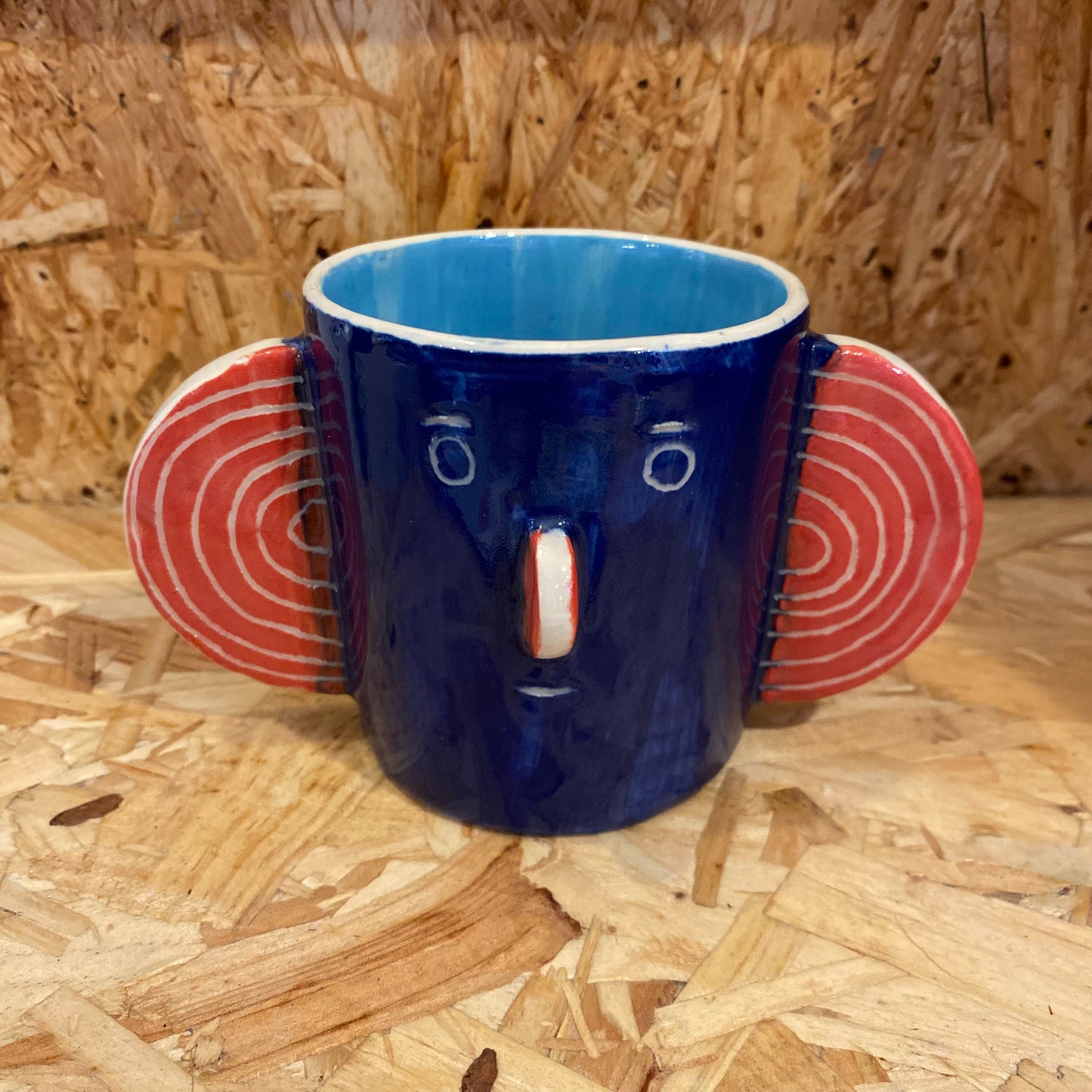 Blue & light blue Head Mug by John Molesworth