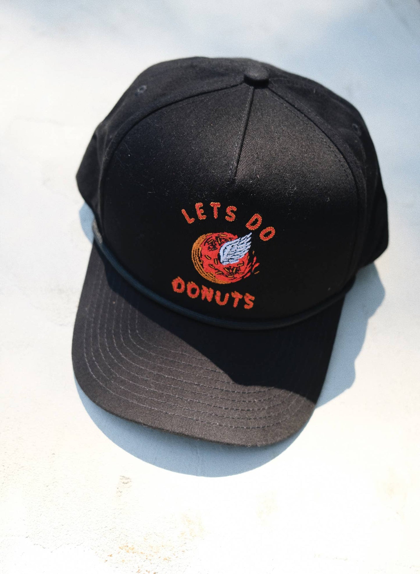 Lets Do Donuts Baseball Hat by Pyknic