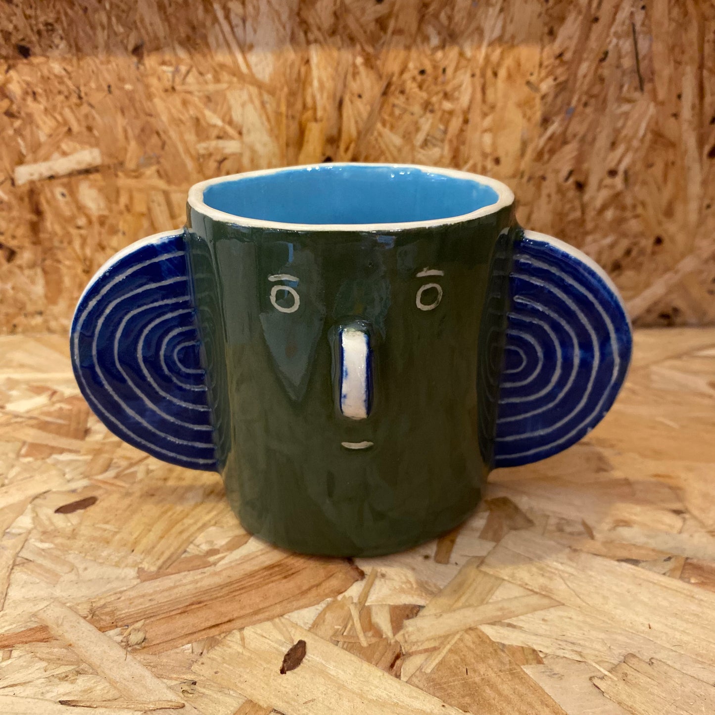 Green & light blue Head Mug by John Molesworth